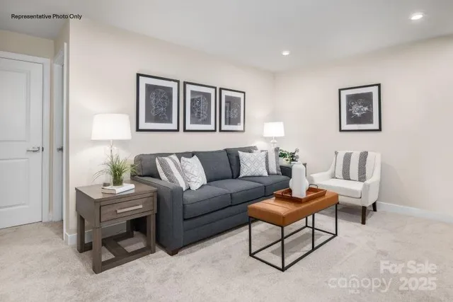 a living room with furniture and a table