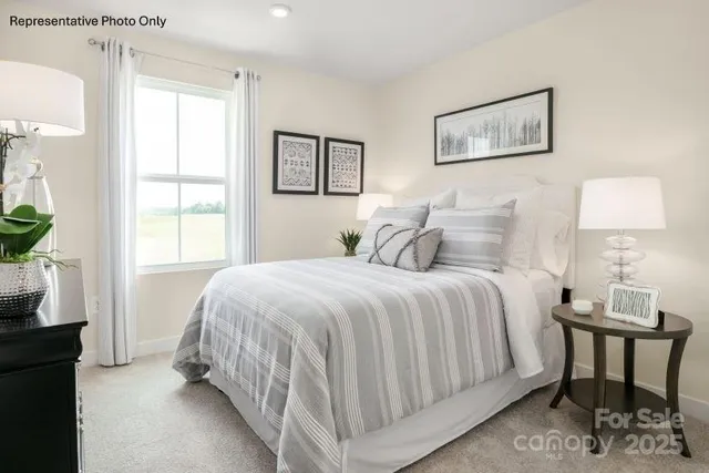 a bedroom with a bed and a table