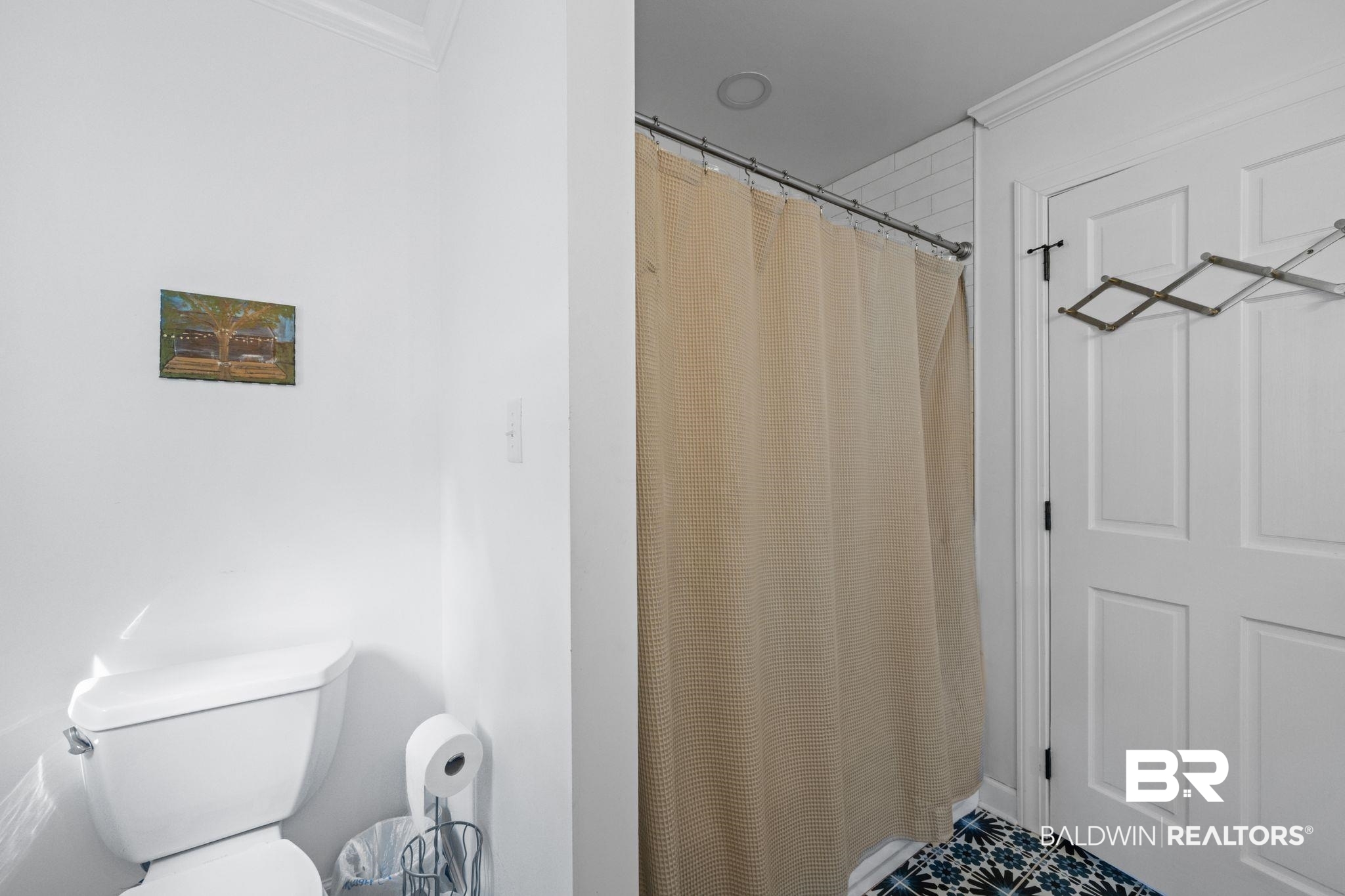 7646 Spring Branch Road Elberta, AL 36530 - Photo 22 of 85 Bathroom featuring crown molding, toilet, a shower with shower curtain, and tile patterned floors