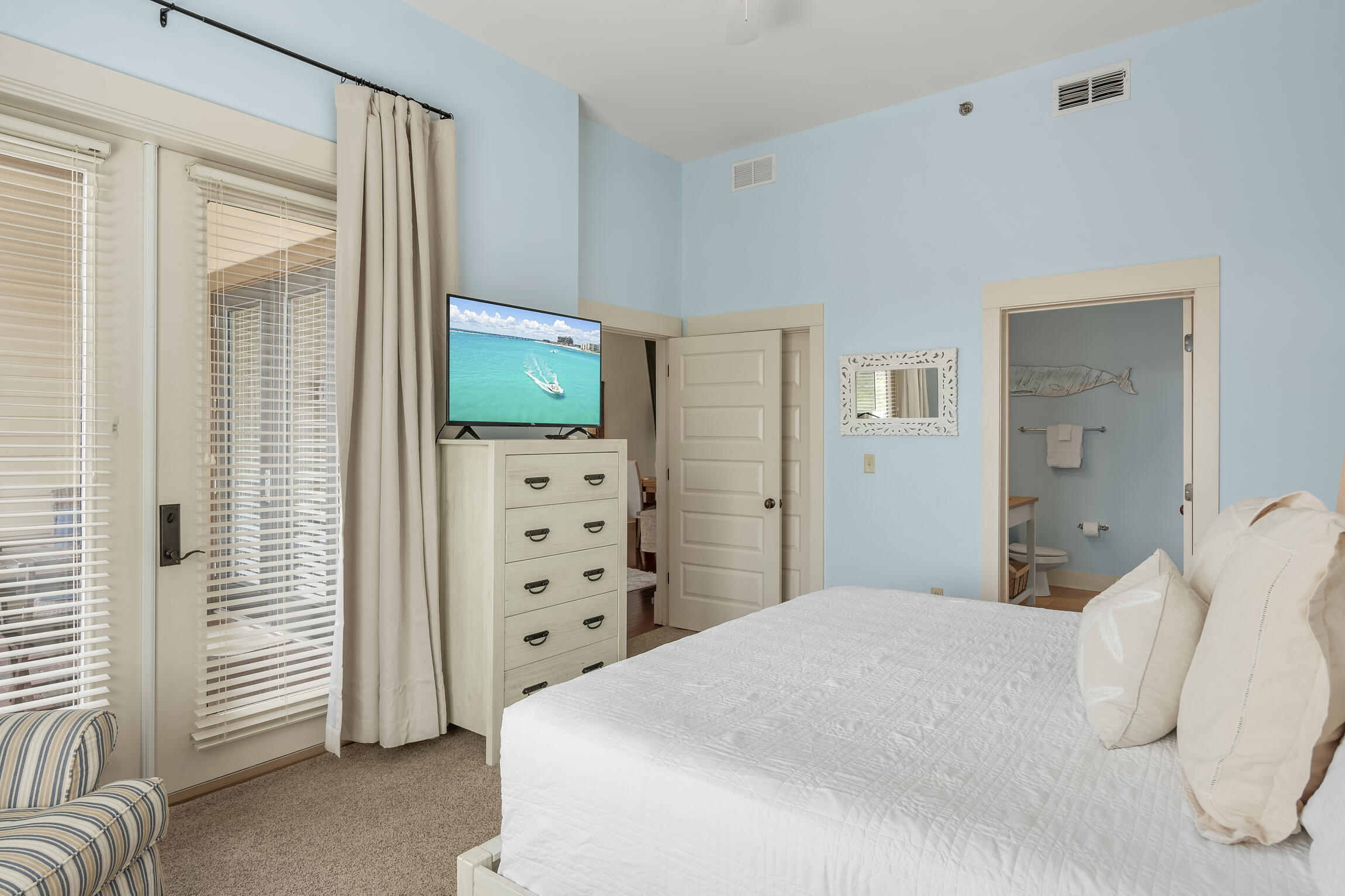 2050 West County Highway 30A, Unit M1219 Santa Rosa Beach, FL 32459 - Photo 12 of 47 a bedroom with a bed and a television