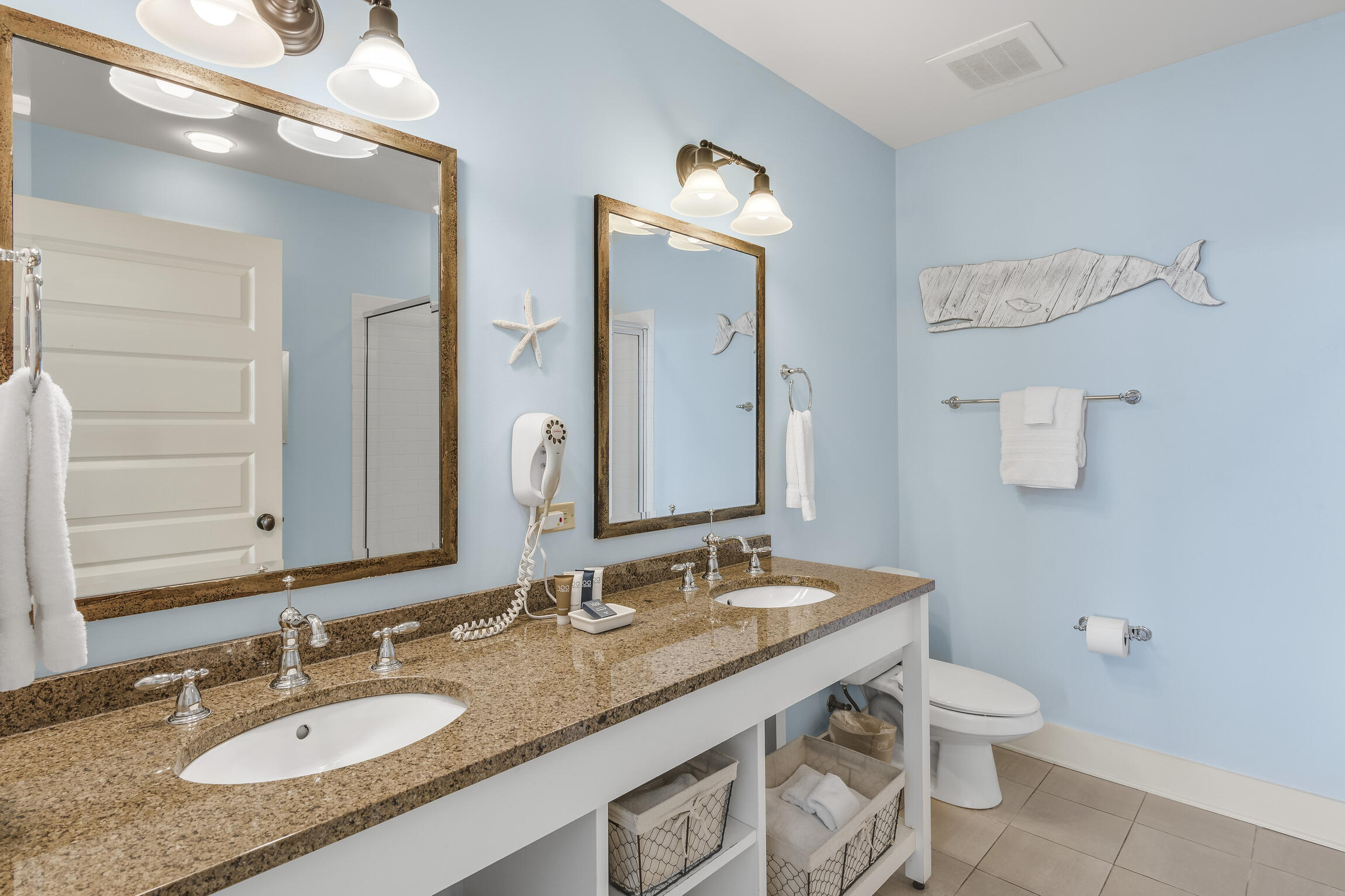 2050 West County Highway 30A, Unit M1219 Santa Rosa Beach, FL 32459 - Photo 13 of 47 a bathroom with a granite countertop sink a toilet and a mirror