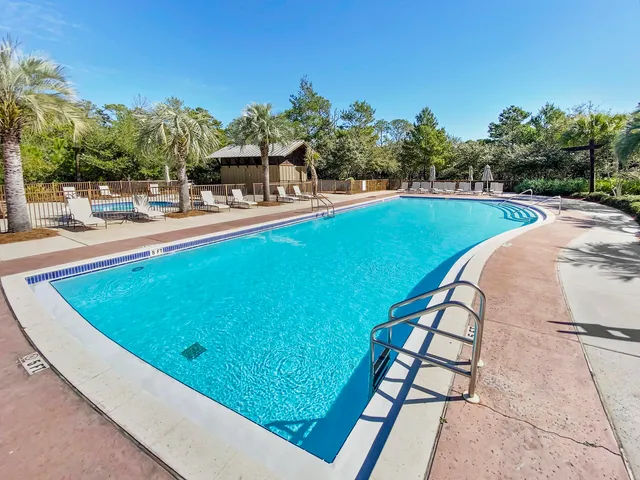 a view of a swimming pool with a lounge chairs