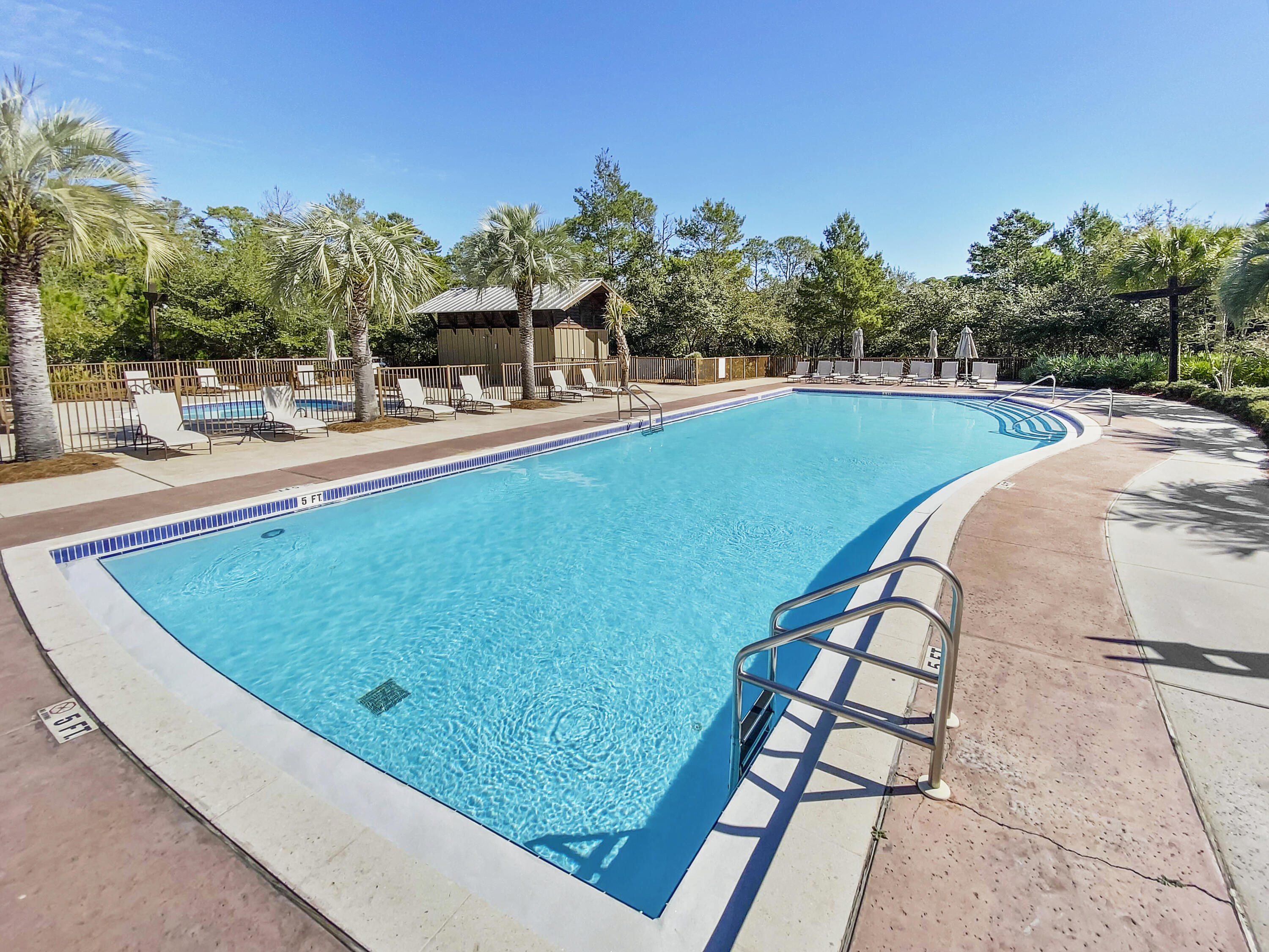 2050 West County Highway 30A, Unit M1219 Santa Rosa Beach, FL 32459 - Photo 24 of 47 a view of a swimming pool with a lounge chairs
