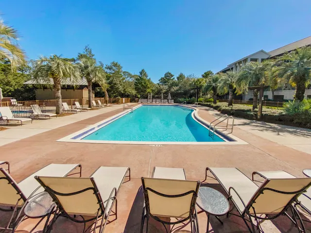 a view of an chairs and table in the patio