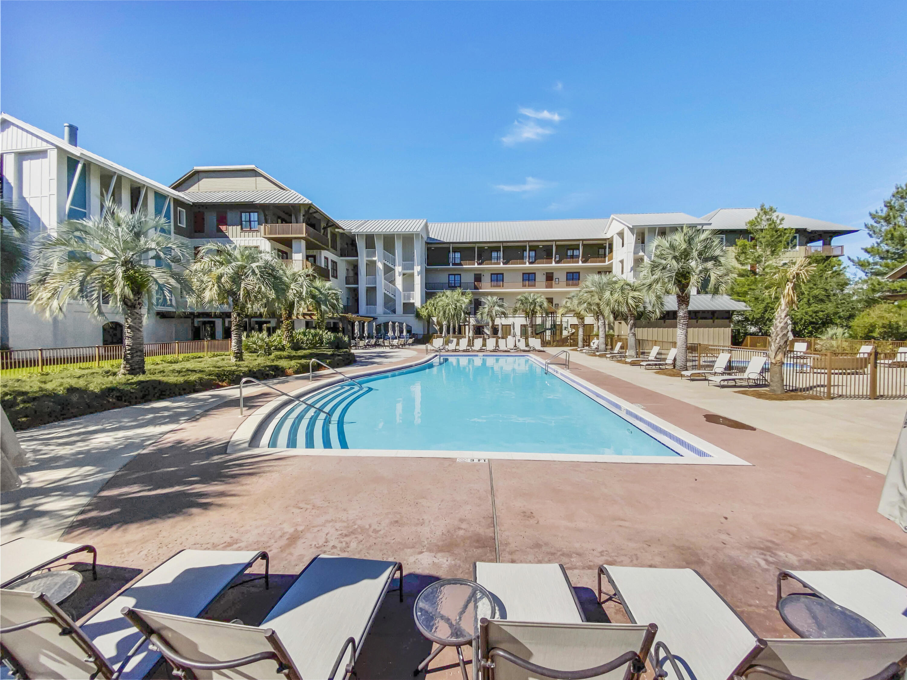 2050 West County Highway 30A, Unit M1219 Santa Rosa Beach, FL 32459 - Photo 27 of 47 a view of an chairs and table in the patio