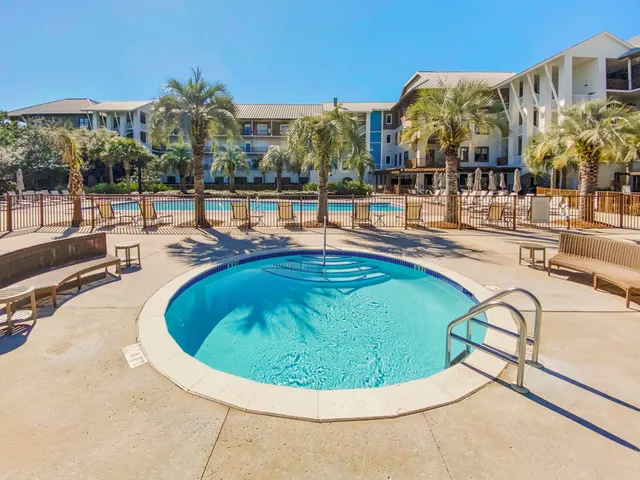 a view of a swimming pool with a patio
