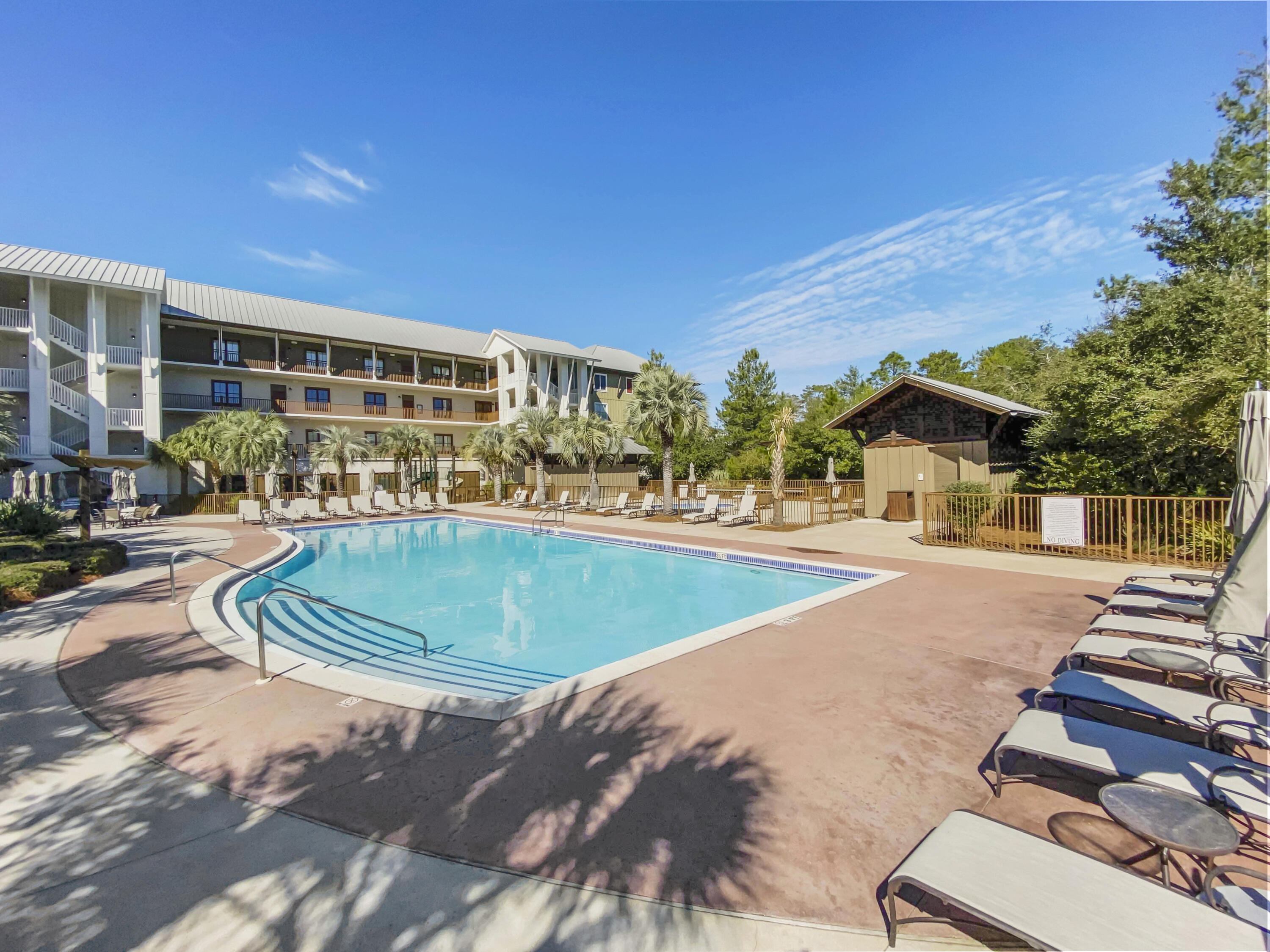 2050 West County Highway 30A, Unit M1219 Santa Rosa Beach, FL 32459 - Photo 30 of 47 a swimming pool with outdoor seating and yard