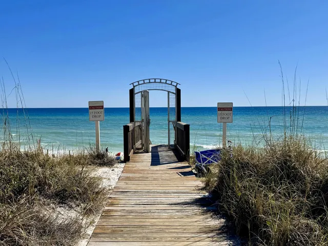 a front view of a residential apartment building with a yard
