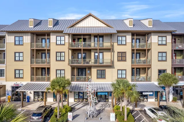 an aerial view of residential houses with city view