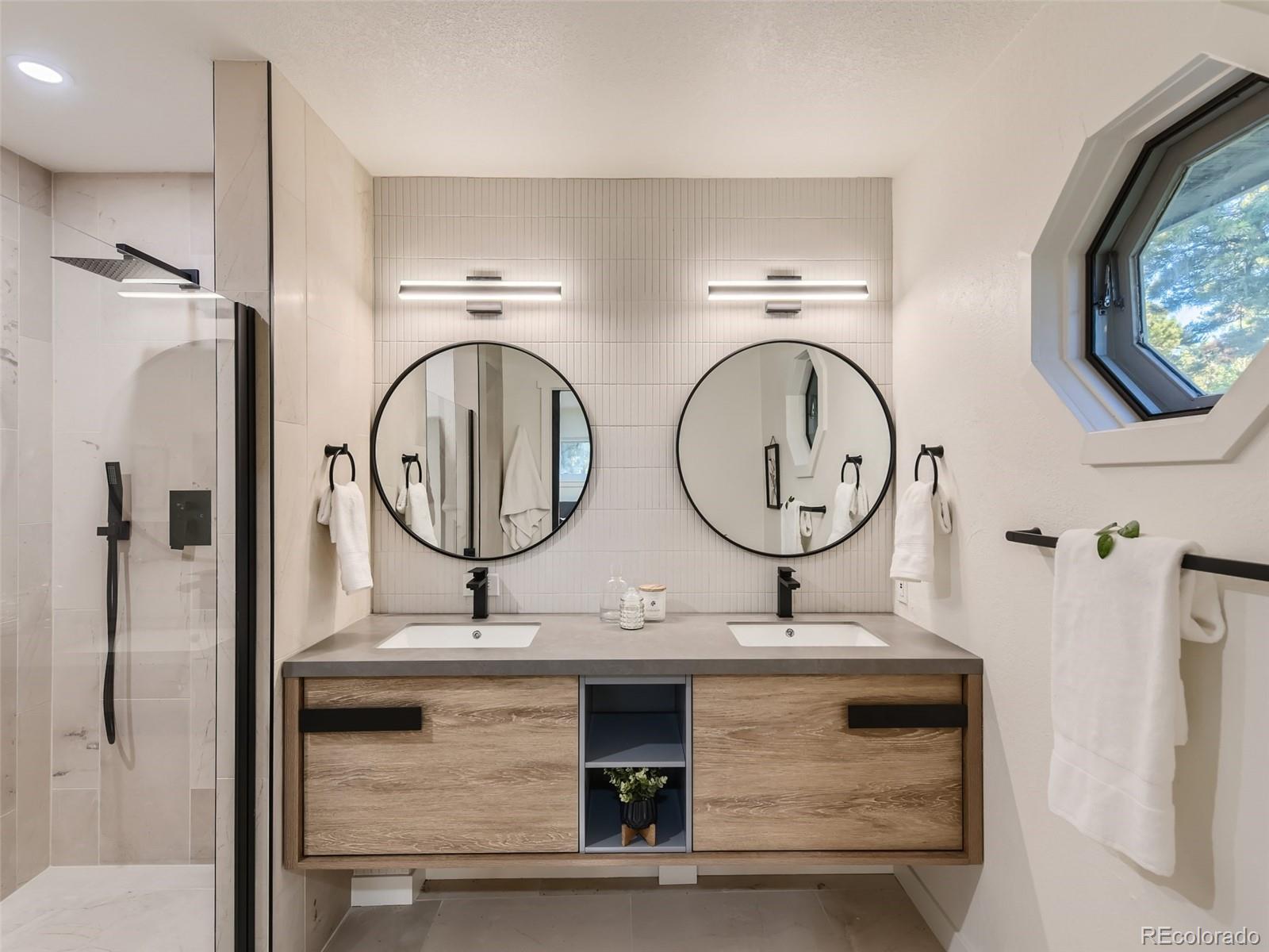 161 Gap Road Black Hawk, CO 80422 - Photo 12 of 28 a bathroom with a sink and a mirror