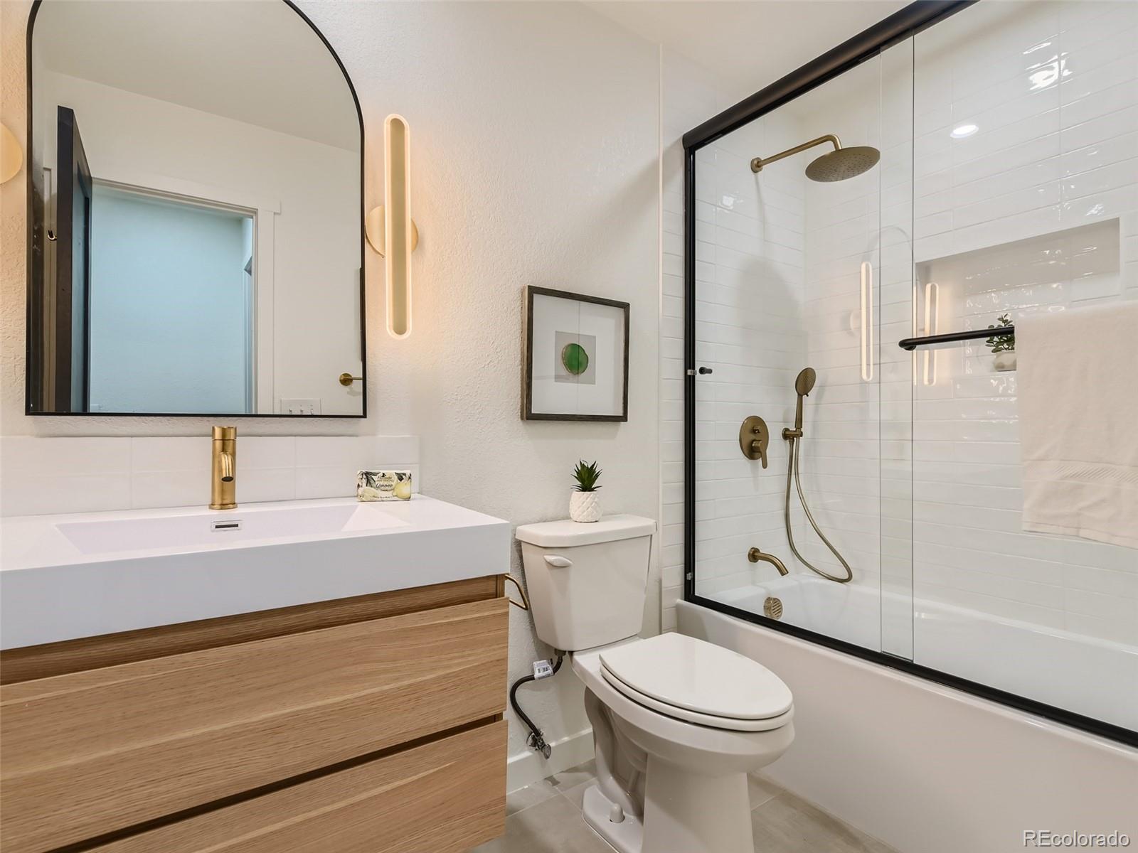161 Gap Road Black Hawk, CO 80422 - Photo 16 of 28 a bathroom with a sink a toilet and shower