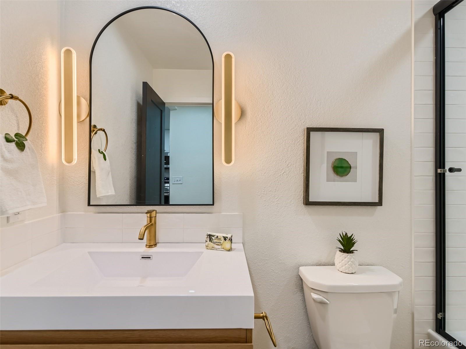 161 Gap Road Black Hawk, CO 80422 - Photo 17 of 28 a bathroom with a sink and a toilet