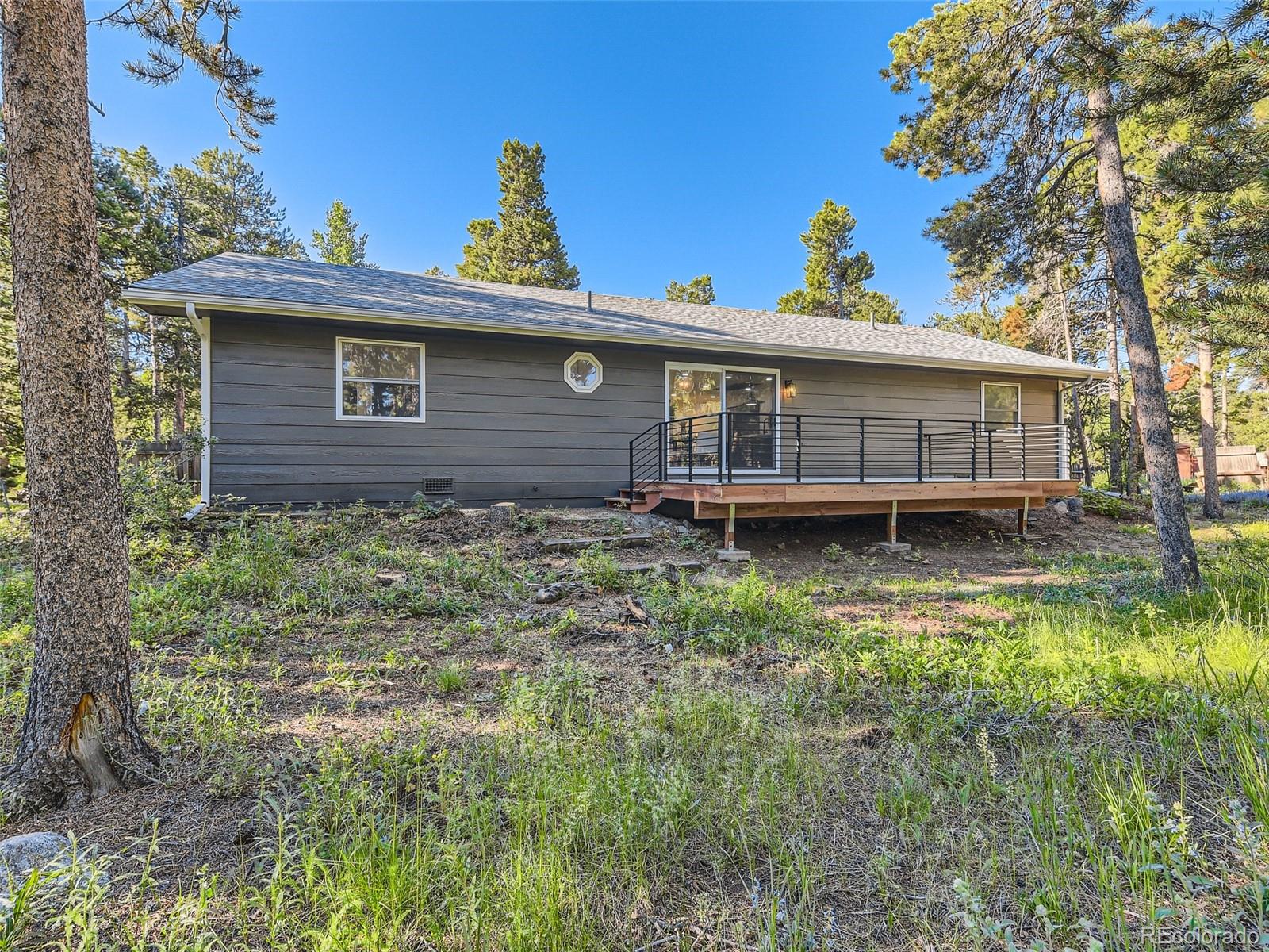 161 Gap Road Black Hawk, CO 80422 - Photo 21 of 28 a view of a house with a yard