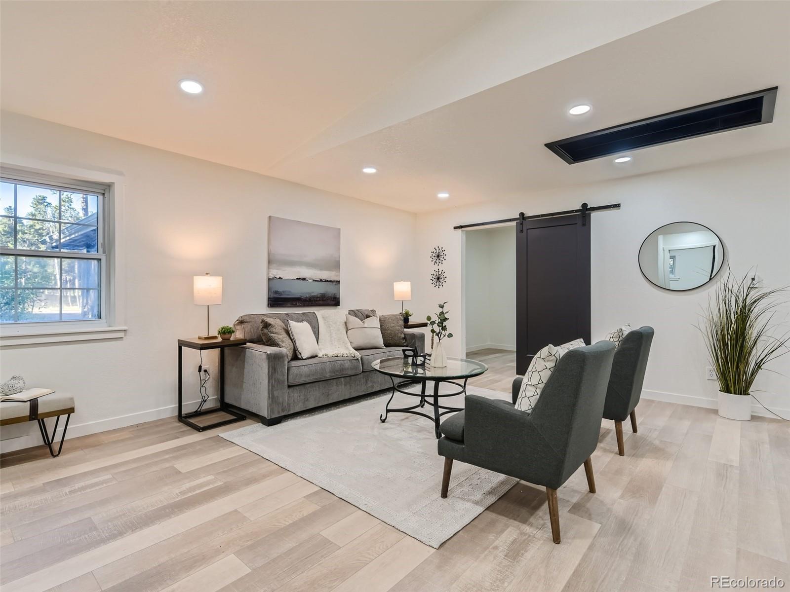 161 Gap Road Black Hawk, CO 80422 - Photo 24 of 28 a living room with furniture and a large window