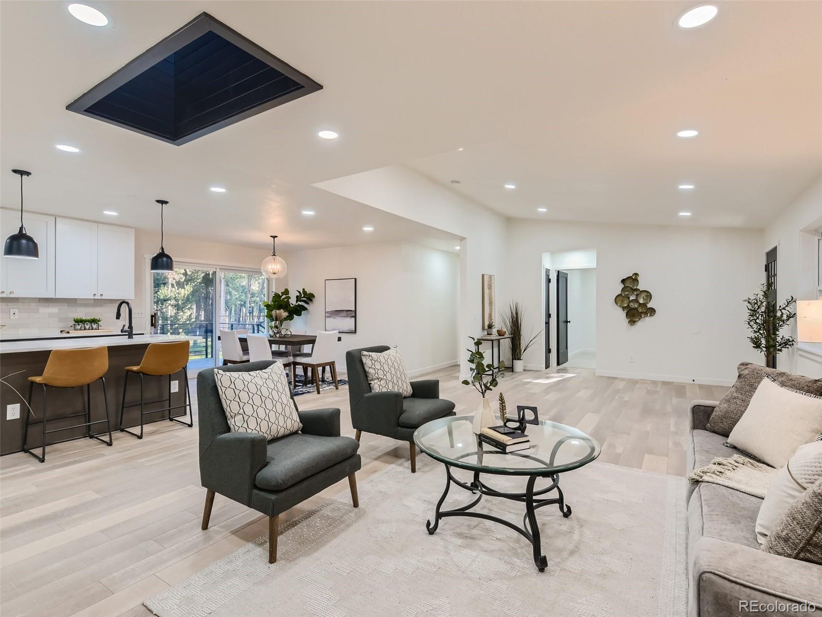 161 Gap Road Black Hawk, CO 80422 - Photo 25 of 28 a living room with furniture and kitchen view