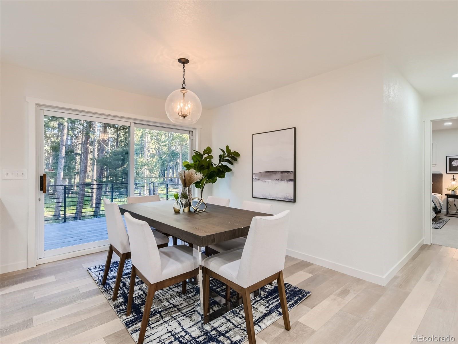 161 Gap Road Black Hawk, CO 80422 - Photo 27 of 28 a dining room with furniture window and wooden floor