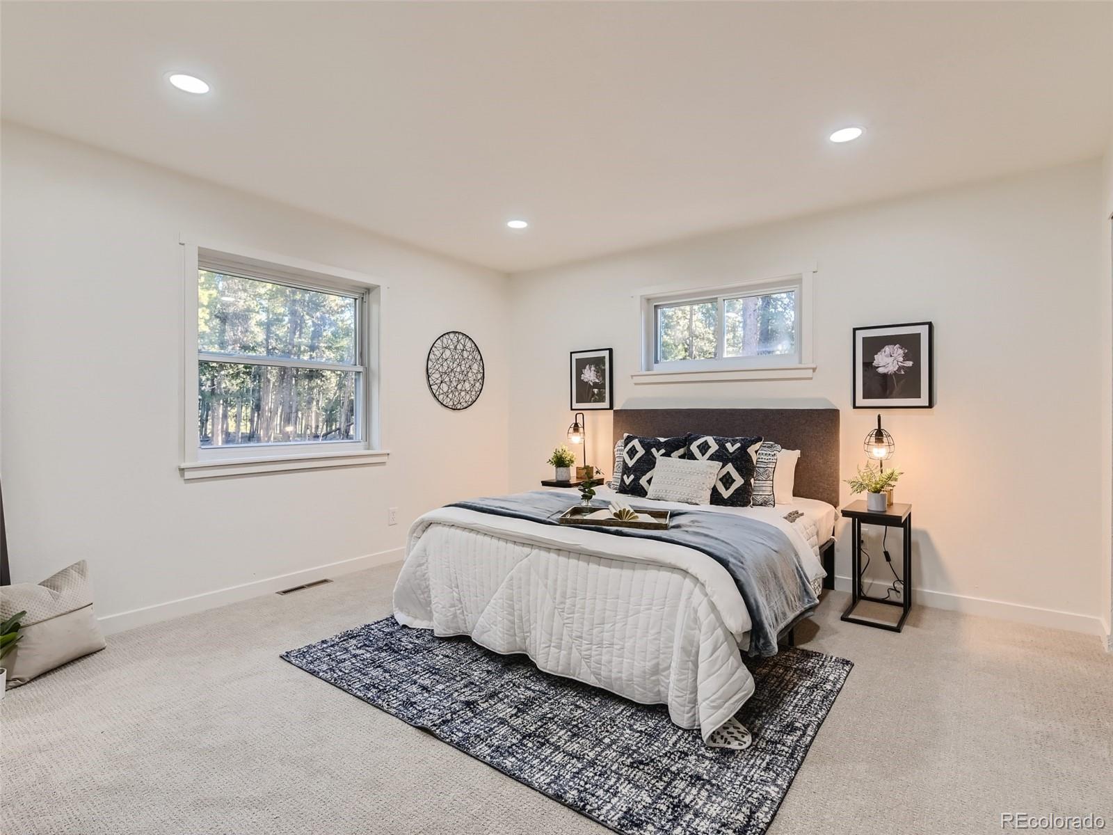 161 Gap Road Black Hawk, CO 80422 - Photo 9 of 28 a bedroom with bed and a window