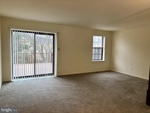 an empty room with a fireplace