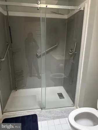 a bathroom with a shower and a bathtub
