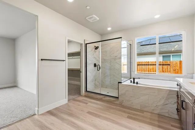 a bathroom with a bathtub and a shower