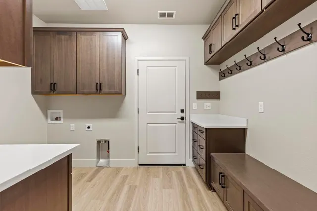 a kitchen with a refrigerator and a sink
