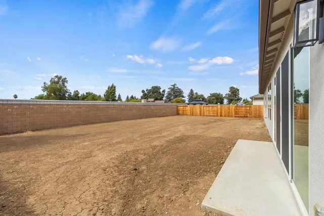 a view of a house with backyard space