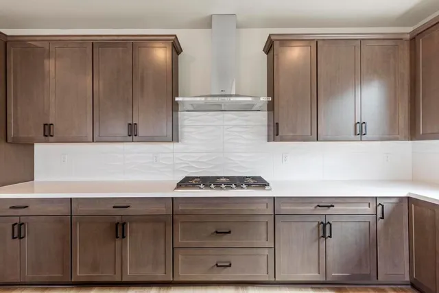 a view of cabinets with wooden floor