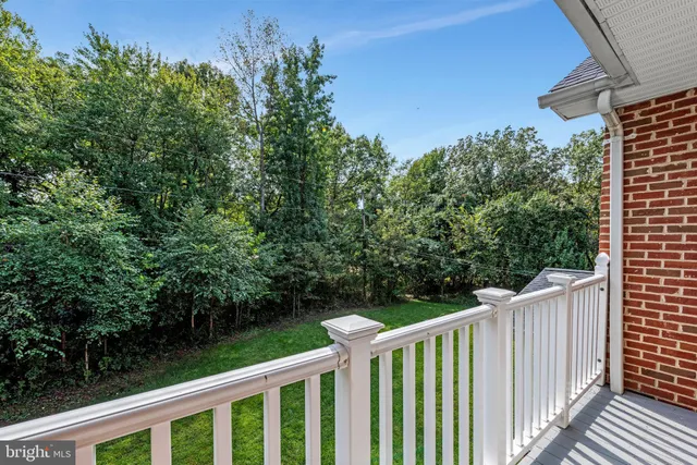 a balcony with wooden fence