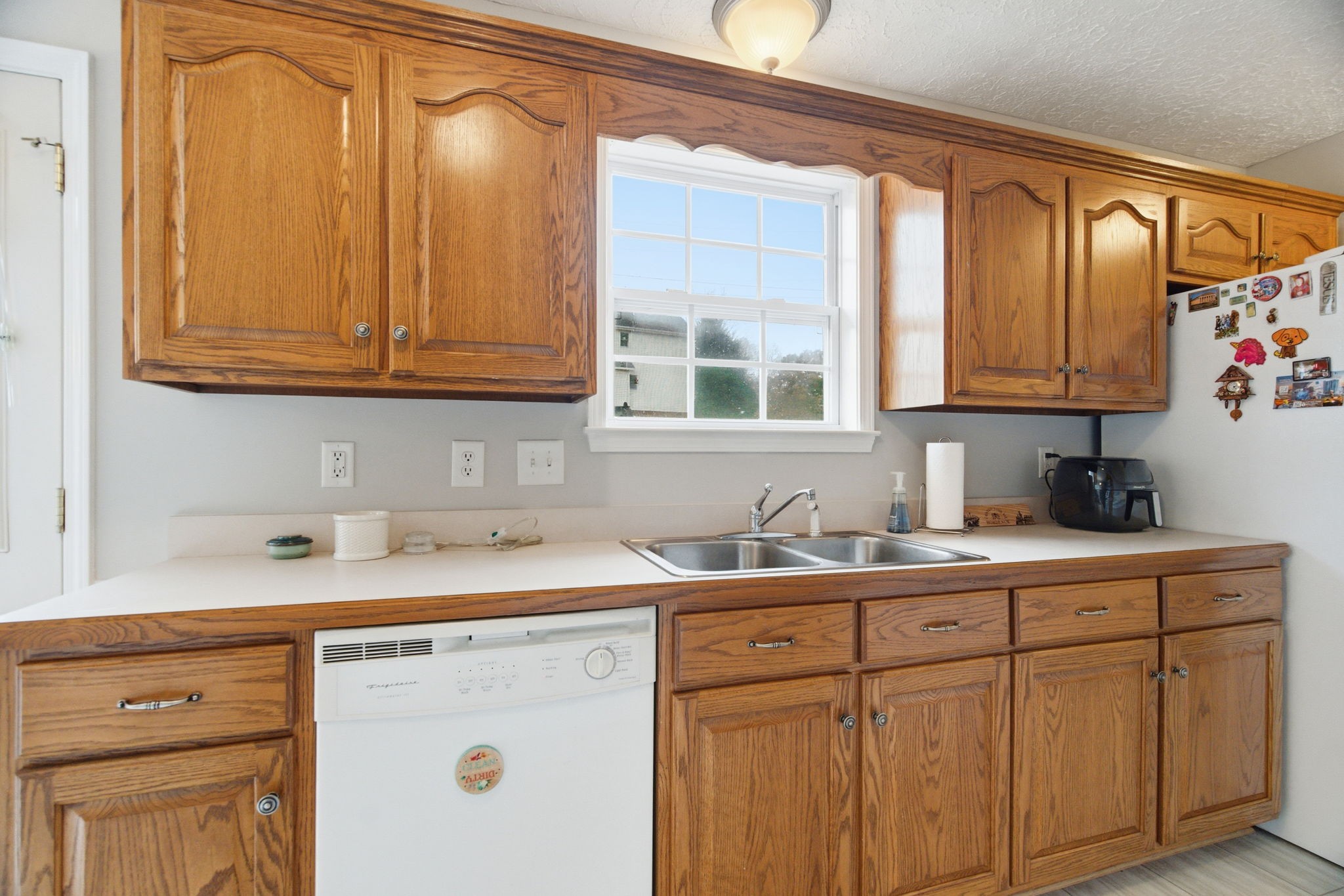 742 Bowling Branch Road Cottontown, TN 37048 - Photo 14 of 42 a kitchen with granite countertop a sink stainless steel appliances and cabinets
