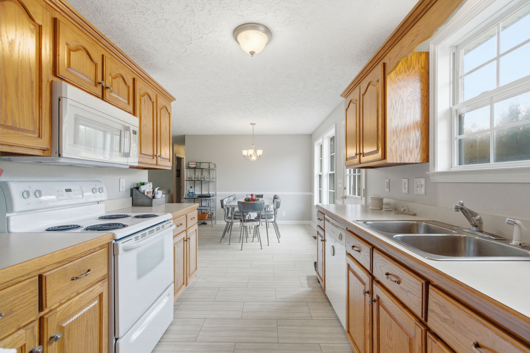742 Bowling Branch Road Cottontown, TN 37048 - Photo 15 of 42 a kitchen with a sink and cabinets