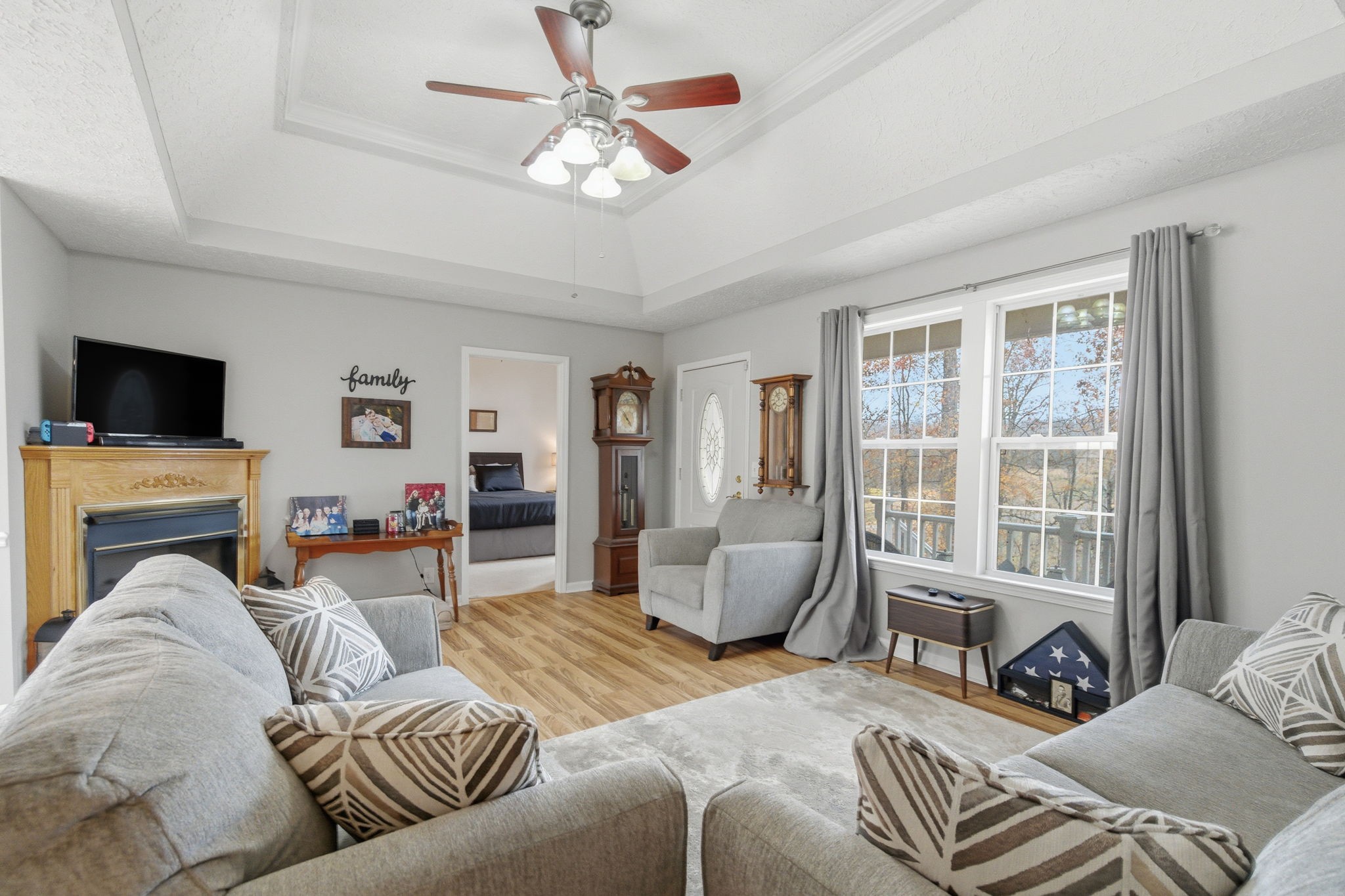 742 Bowling Branch Road Cottontown, TN 37048 - Photo 19 of 42 a living room with furniture a fireplace and a flat screen tv