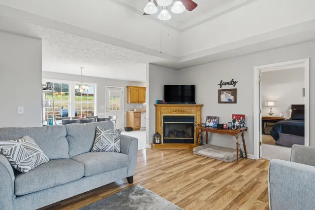 a front view of a house with cars parked