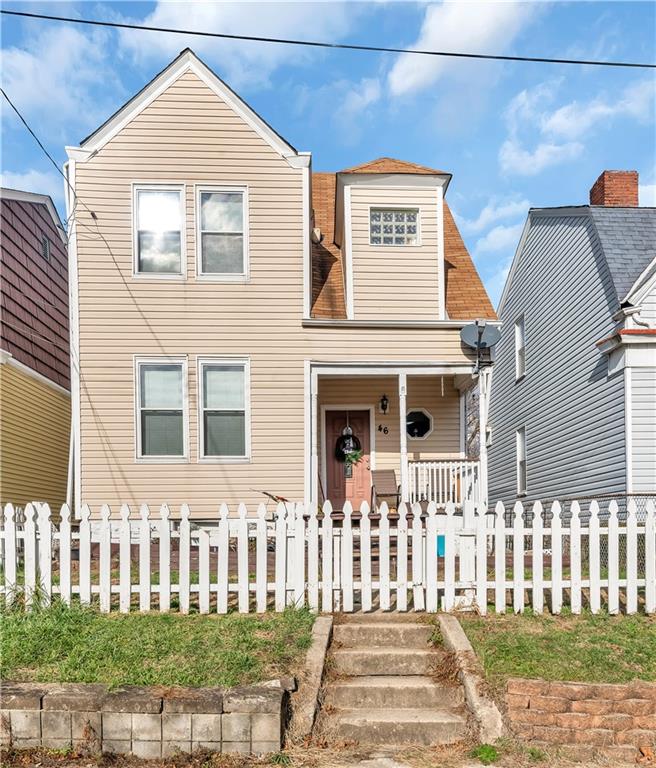 46 Frazier Avenue McKees Rocks, PA 15136 - Photo 1 of 12 a front view of a house with a yard
