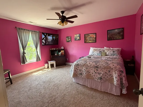 a kitchen with stainless steel appliances kitchen island granite countertop a refrigerator stove and sink