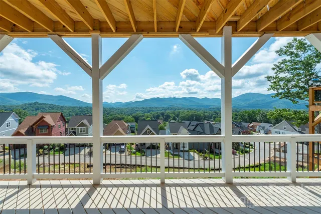 an aerial view of a house with swimming pool