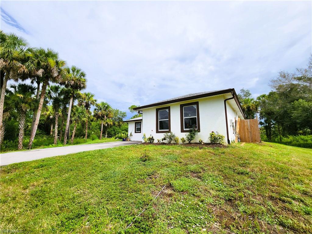 4045 34th Avenue Southeast Naples, FL 34117 - Photo 30 of 30 Single story home with stucco siding and driveway