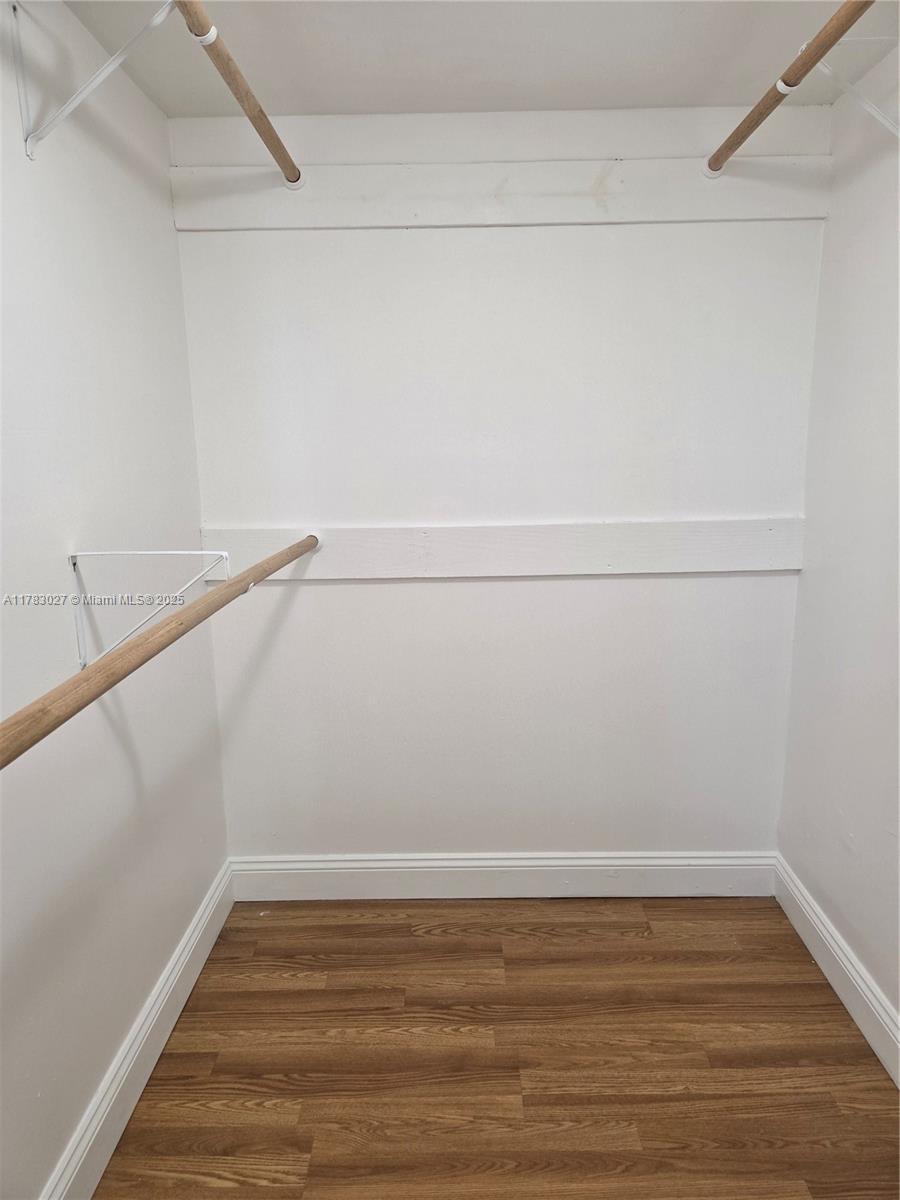 8850 Southwest 123rd Court, Unit H302 Miami, FL 33186 - Photo 11 of 28 a view of an empty walk in closet