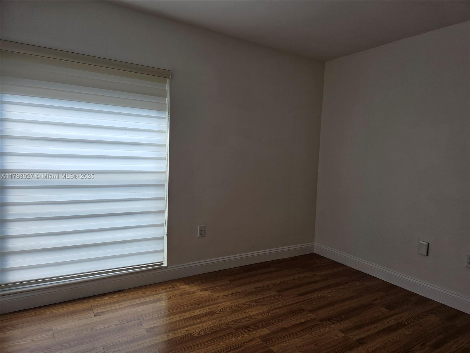8850 Southwest 123rd Court, Unit H302 Miami, FL 33186 - Photo 17 of 28 a view of a small space with wooden floor