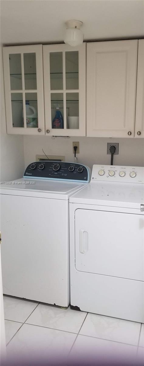 8850 Southwest 123rd Court, Unit H302 Miami, FL 33186 - Photo 24 of 28 a utility room with dryer and washer
