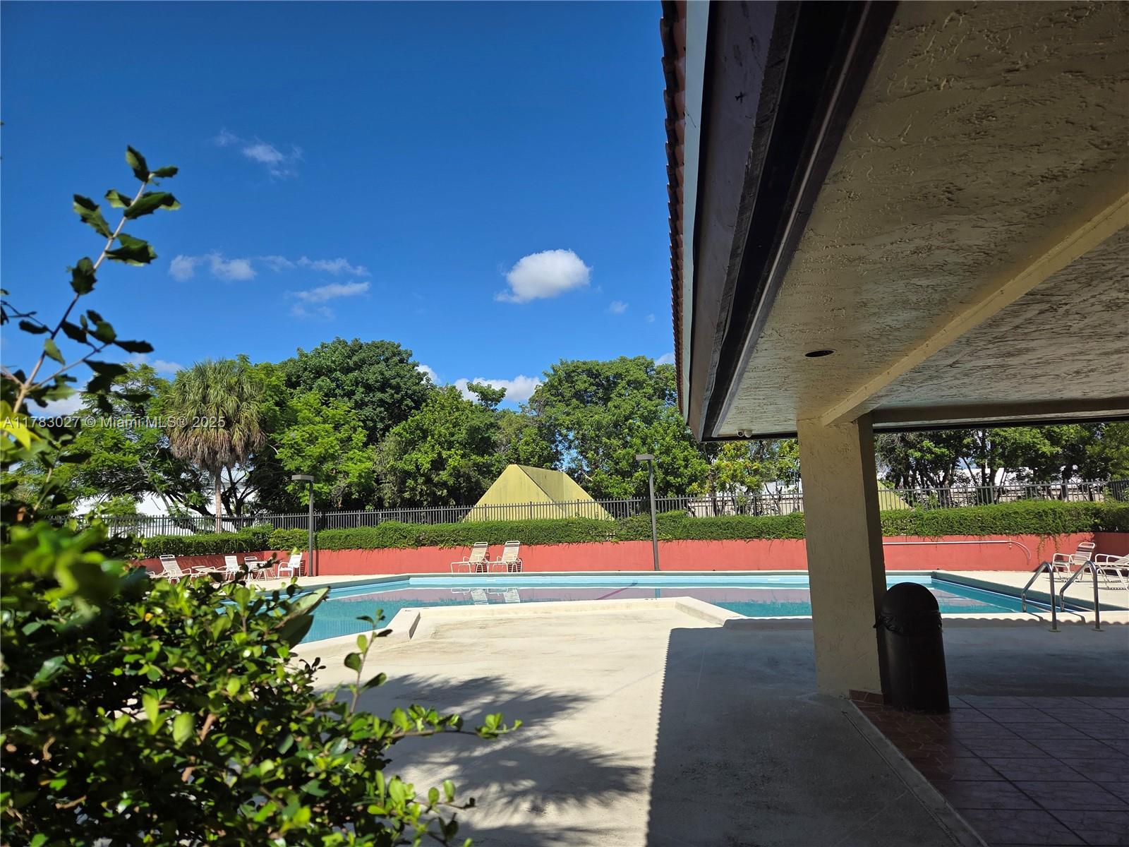 8850 Southwest 123rd Court, Unit H302 Miami, FL 33186 - Photo 27 of 28 a view of outdoor space and porch