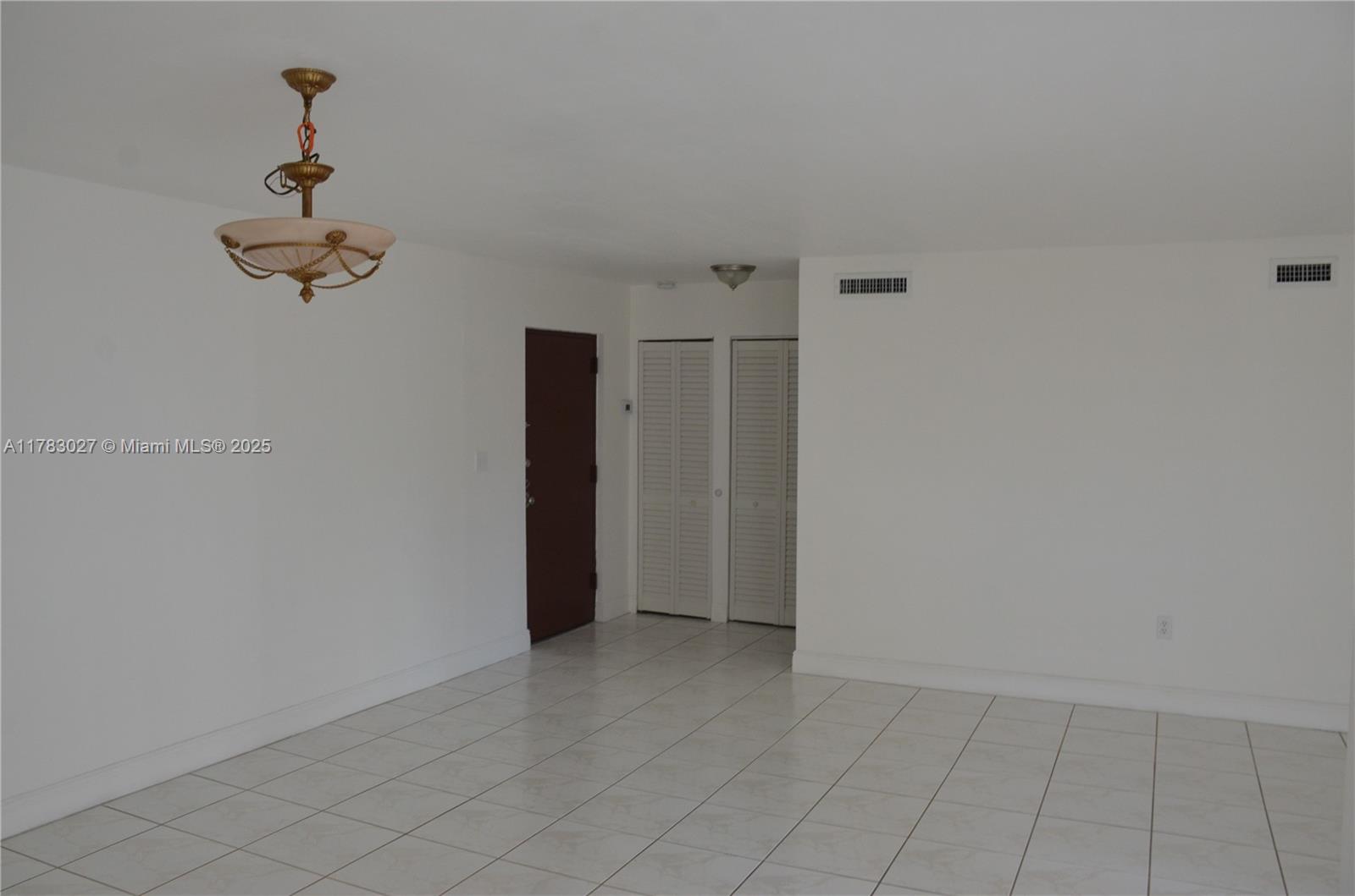 8850 Southwest 123rd Court, Unit H302 Miami, FL 33186 - Photo 3 of 28 wooden floor in an empty room