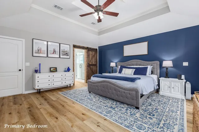 a bedroom with a bed and a walk in closet