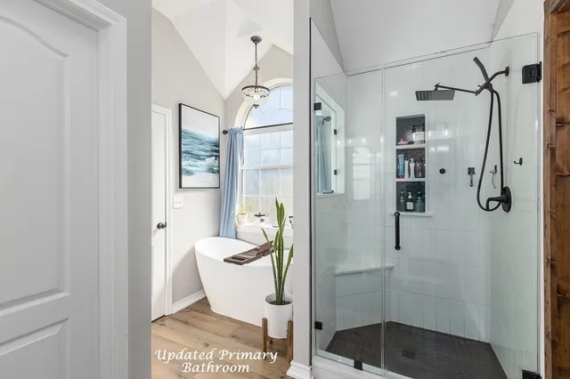 a bathroom with a shower and toilet