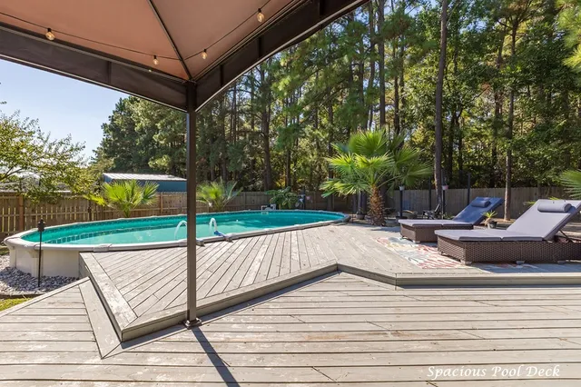 a view of a patio with a table and chairs