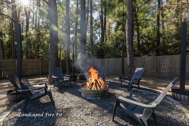 a view of a backyard with sitting area