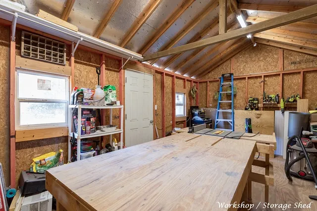 a room with lots of wooden furniture and a table