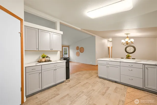 a kitchen with sink and cabinets