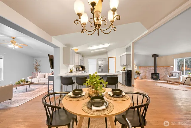 a view of a dining room with furniture and wooden floor