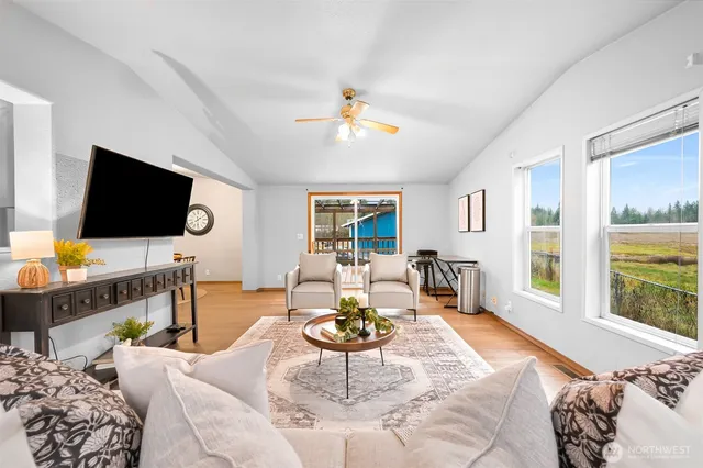 a living room with furniture and a flat screen tv