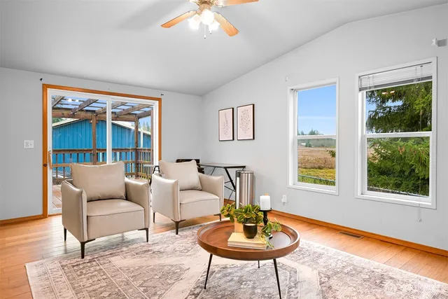 a living room with furniture and a large window